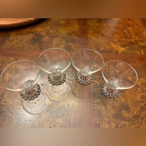 Set of four clear Anchor Hocking Berwick Boopie pattern dessert glasses.